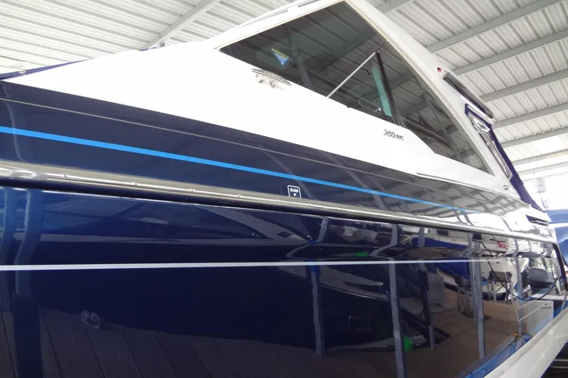 Master Plan Yacht Photos Pics 2023 Formula 380 Super Sport Crossover I/O boat in a covered marina.