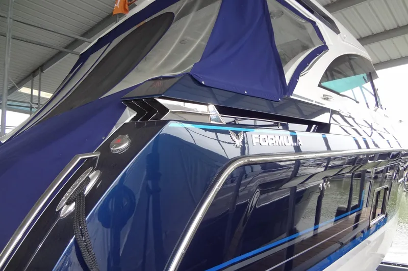 Master Plan Yacht Photos Pics 2023 Formula 380 Super Sport Crossover I/O yacht in marina, sleek blue design.