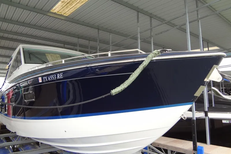 Master Plan Yacht Photos Pics 2023 Formula 380 Super Sport Crossover I/O boat docked in covered marina.