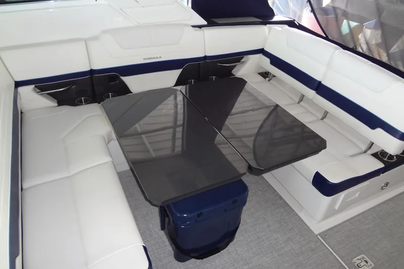 Master Plan Yacht Photos Pics 2023 Formula 380 Super Sport Crossover I/O interior with sleek seating and modern table design.