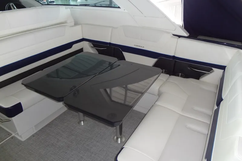Master Plan Yacht Photos Pics 2023 Formula 380 Super Sport Crossover I/O interior with sleek seating and modern table design.