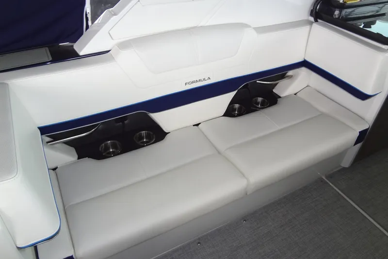 Master Plan Yacht Photos Pics 2023 Formula 380 Super Sport Crossover I/O boat interior with white seating and cup holders.