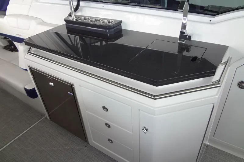 Master Plan Yacht Photos Pics 2023 Formula 380 Super Sport Crossover I/O boat interior with sleek kitchenette and modern fixtures.