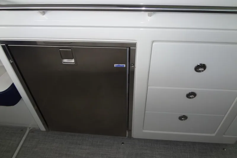 Master Plan Yacht Photos Pics 2023 Formula 380 Super Sport Crossover I/O interior with stainless steel fridge and storage drawers.