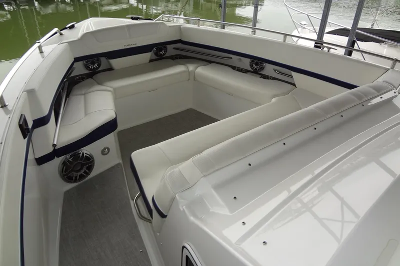 Master Plan Yacht Photos Pics 2023 Formula 380 Super Sport Crossover I/O boat interior with white seating and speakers.