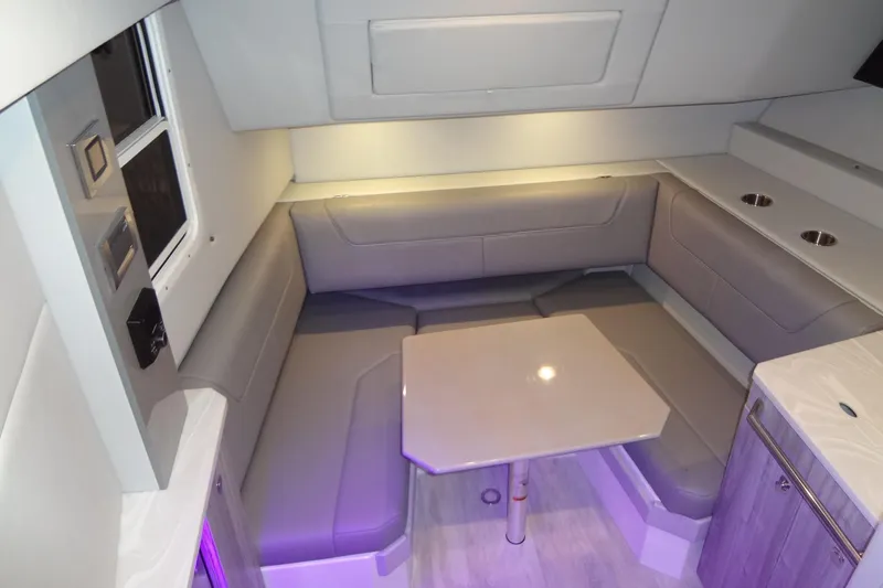 Master Plan Yacht Photos Pics 2023 Formula 380 Super Sport Crossover I/O interior with modern seating and table.