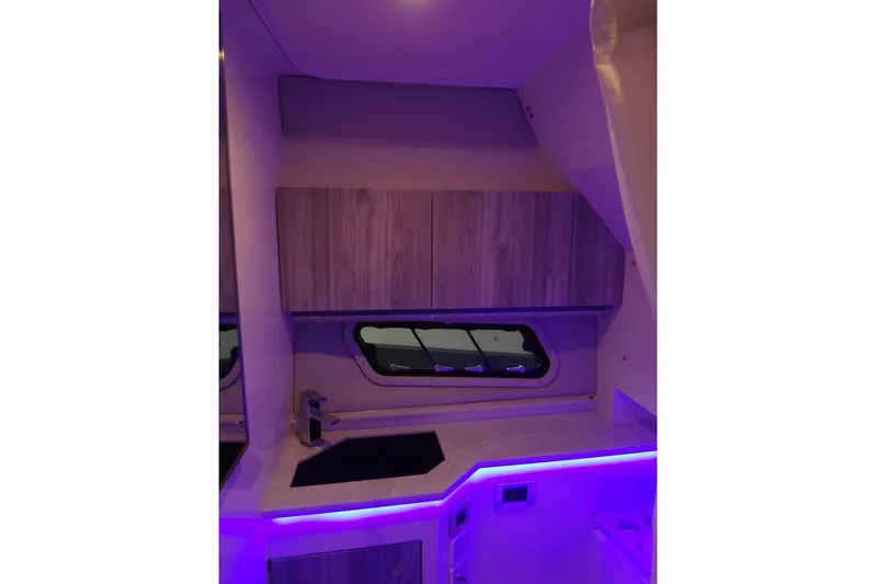 Master Plan Yacht Photos Pics Interior of 2023 Formula 380 Super Sport Crossover I/O with modern cabinetry and ambient lighting.