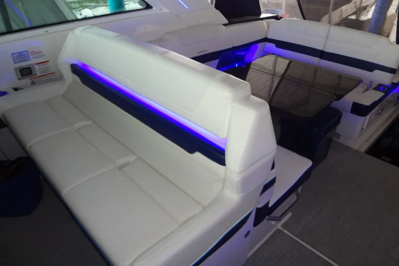 Master Plan Yacht Photos Pics 2023 Formula 380 Super Sport Crossover I/O interior with white seating and blue LED lighting.