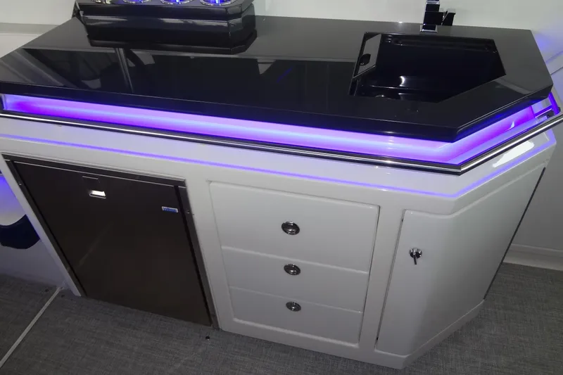 Master Plan Yacht Photos Pics 2023 Formula 380 Super Sport Crossover I/O interior with sleek countertop and ambient lighting.