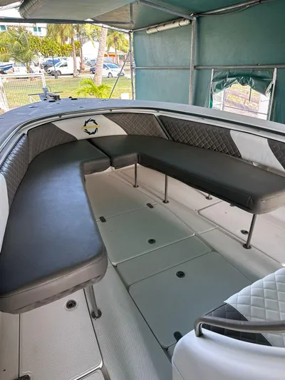  Yacht Photos Pics 2003 Fountain 34 CC boat interior with cushioned seating and spacious deck.