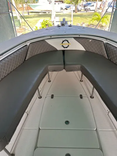  Yacht Photos Pics 2003 Fountain 34 CC boat interior with cushioned seating and sleek design.