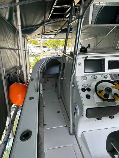  Yacht Photos Pics 2003 Fountain 34 CC boat interior with control panel and seating area.