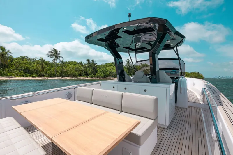 M/y Wavemoji Yacht Photos Pics 2022 Pardo Yachts 38 with sleek design, spacious deck, and luxurious seating near tropical shoreline.