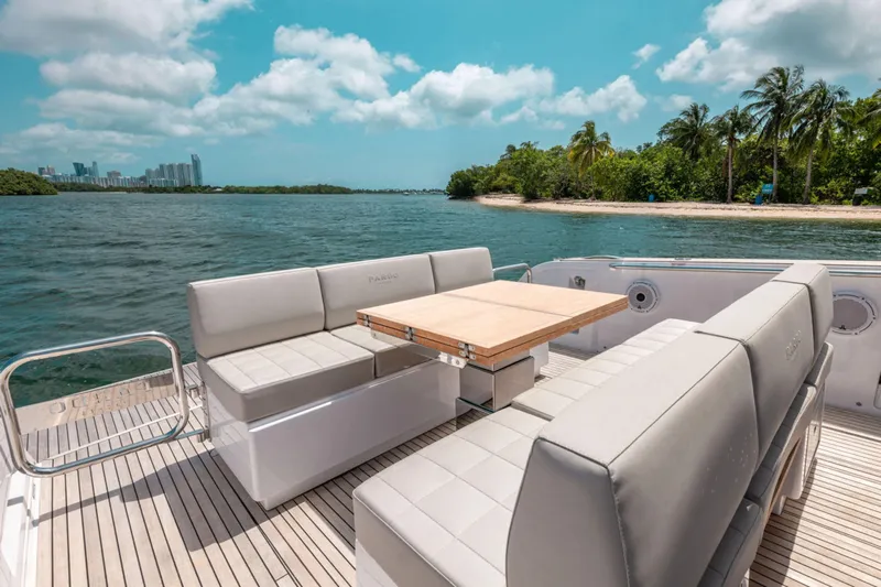 Pardo 38#321 (new) Yacht Photos Pics Luxurious 2025 Pardo Yachts 38 with elegant seating, cruising near a tropical shoreline.