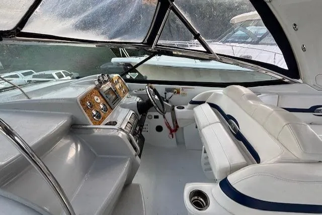  Yacht Photos Pics 2009 Formula 350 Sun Sport boat interior with white seating and control panel.