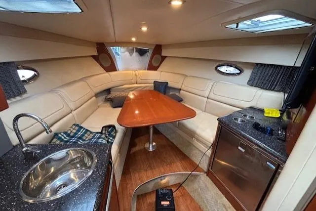  Yacht Photos Pics Luxurious interior of a 2009 Formula 350 Sun Sport boat with seating and kitchenette.