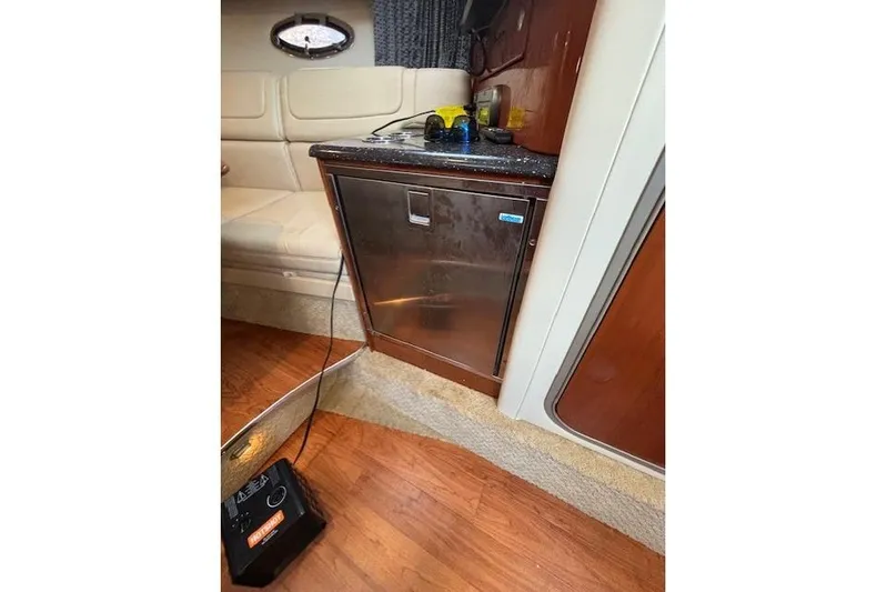  Yacht Photos Pics Interior of 2009 Formula 350 Sun Sport boat with kitchenette and seating area.