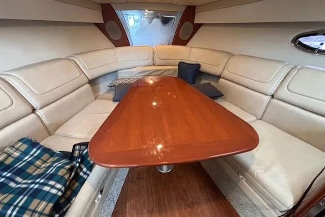  Yacht Photos Pics Interior of 2009 Formula 350 Sun Sport boat with elegant seating and wooden table.
