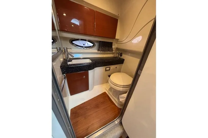  Yacht Photos Pics 2009 Formula 350 Sun Sport boat bathroom with sink, toilet, and wood flooring.