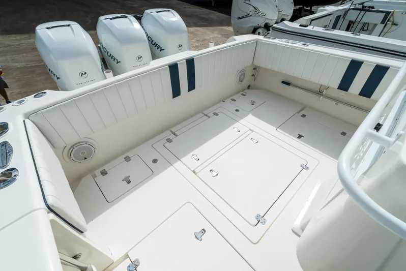  Yacht Photos Pics 2010 Intrepid 370 Cuddy boat deck with spacious seating and storage compartments.