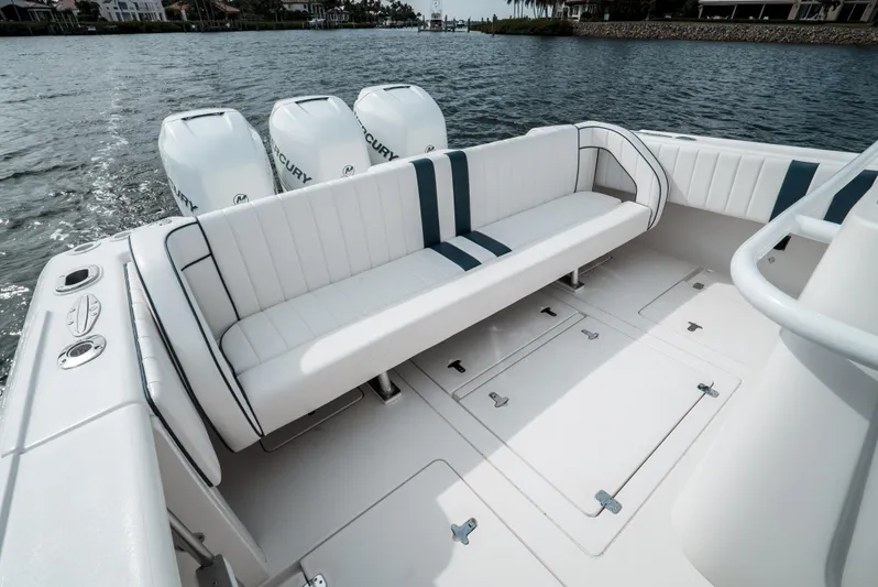  Yacht Photos Pics 2010 Intrepid 370 Cuddy boat with spacious seating and triple Mercury outboard engines.