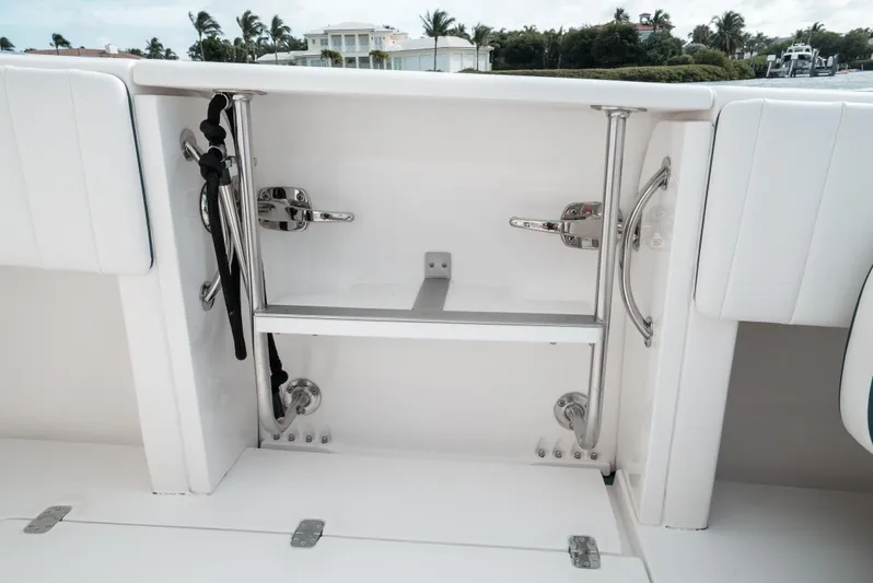  Yacht Photos Pics 2010 Intrepid 370 Cuddy boat storage compartment with stainless steel fittings.