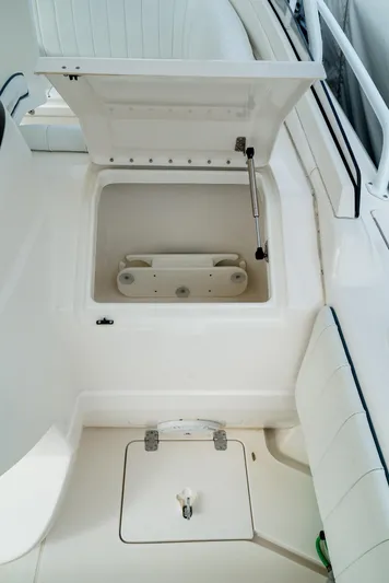  Yacht Photos Pics 2010 Intrepid 370 Cuddy boat storage compartment with open hatch.