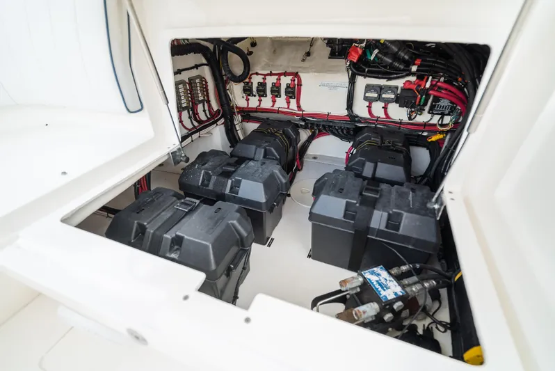  Yacht Photos Pics 2010 Intrepid 370 Cuddy boat battery compartment with wiring and components.