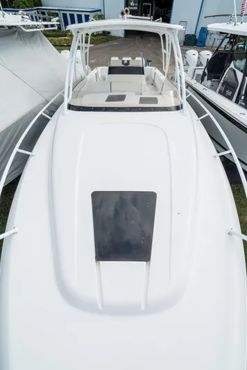  Yacht Photos Pics 2010 Intrepid 370 Cuddy boat, white exterior, docked, aerial view.