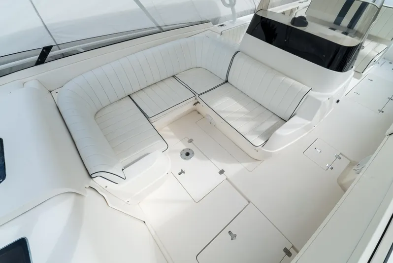  Yacht Photos Pics 2010 Intrepid 370 Cuddy boat interior with white seating and spacious deck.
