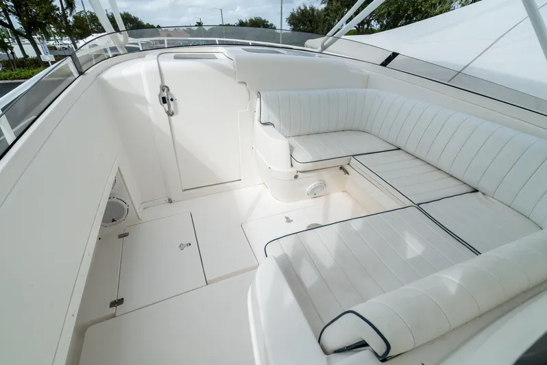  Yacht Photos Pics 2010 Intrepid 370 Cuddy interior with white cushioned seating.