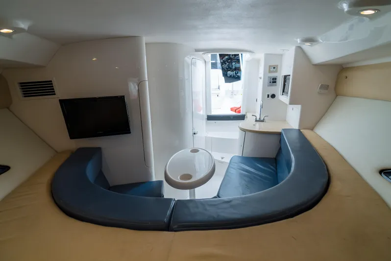  Yacht Photos Pics 2010 Intrepid 370 Cuddy interior with seating, table, and TV.