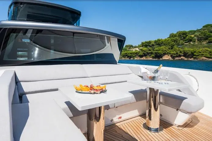  Yacht Photos Pics Luxurious 2024 Sanlorenzo SX76 yacht deck with elegant seating and dining setup.