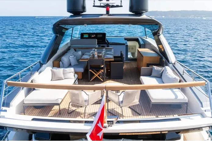  Yacht Photos Pics Luxurious 2024 Sanlorenzo SX76 yacht with elegant deck seating and dining area on the ocean.