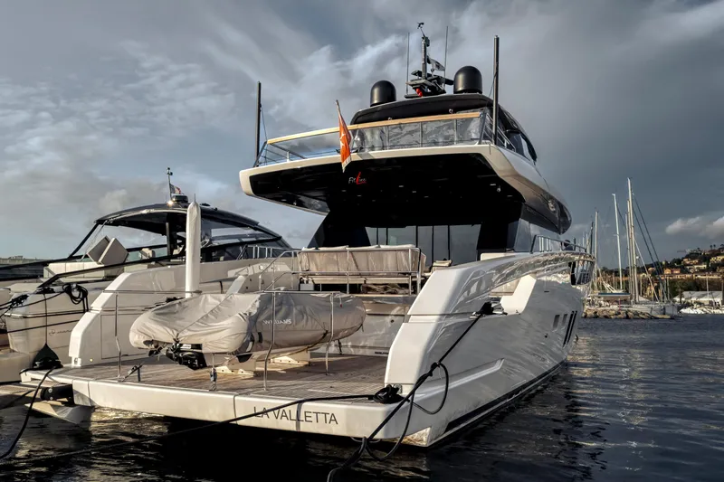  Yacht Photos Pics Luxury Sanlorenzo SX76 yacht, 2024 model, docked at marina under cloudy sky.