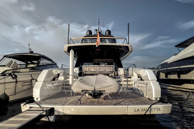  Yacht Photos Pics 2024 Sanlorenzo SX76 yacht docked at marina, rear view with covered equipment.