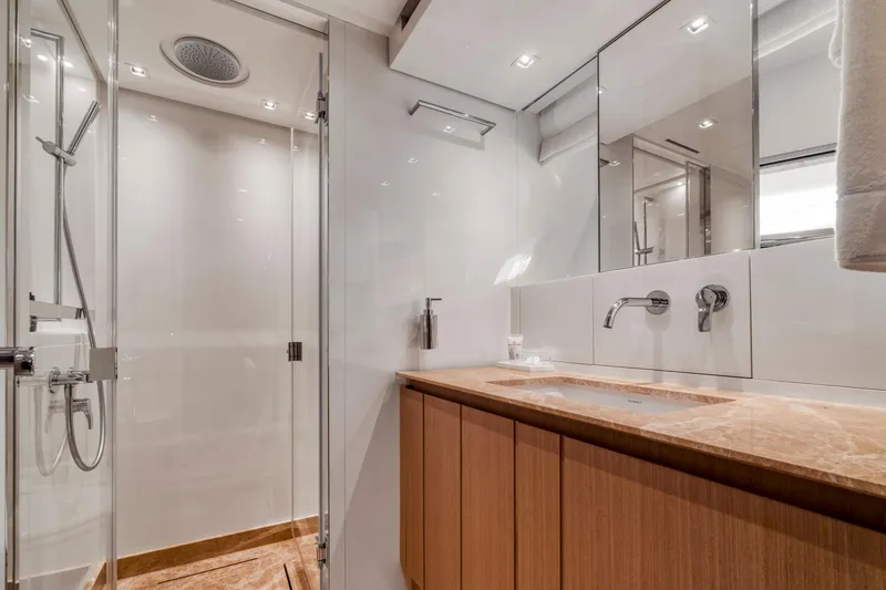  Yacht Photos Pics Luxurious bathroom in 2024 Sanlorenzo SX76 yacht with modern fixtures and elegant design.