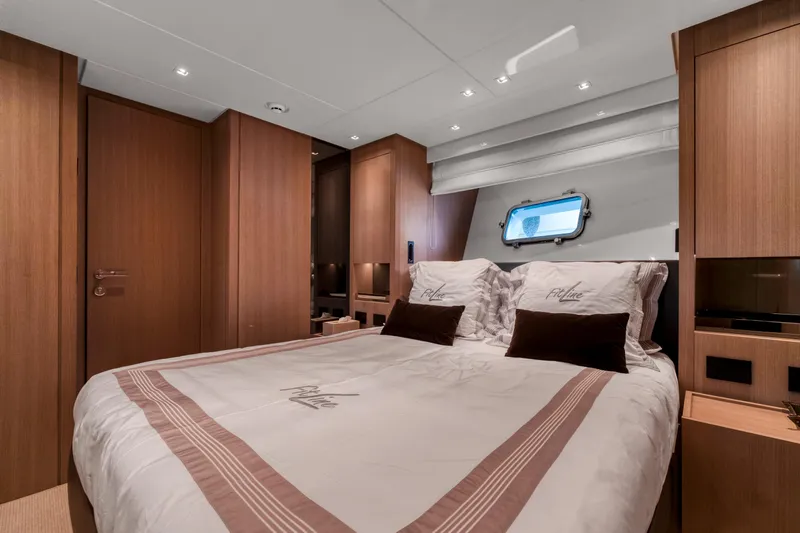  Yacht Photos Pics Luxurious cabin interior of 2024 Sanlorenzo SX76 yacht with elegant wood finishes.