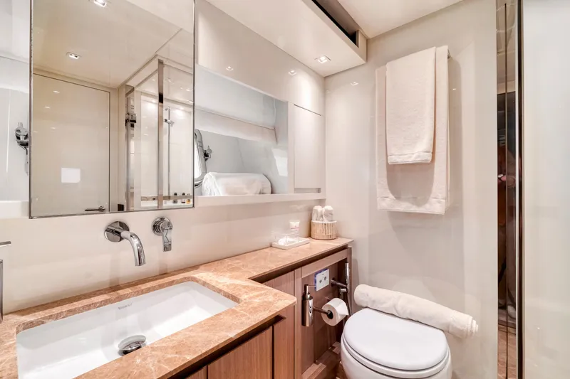  Yacht Photos Pics Luxurious bathroom in 2024 Sanlorenzo SX76 yacht, featuring elegant fixtures and modern design.