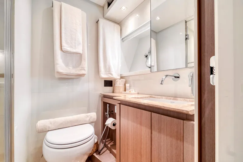  Yacht Photos Pics Luxurious bathroom in 2024 Sanlorenzo SX76 yacht with modern fixtures and elegant design.