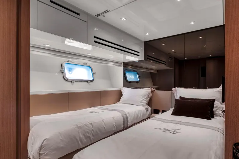  Yacht Photos Pics Luxurious twin cabin interior of 2024 Sanlorenzo SX76 yacht, featuring modern design and comfort.