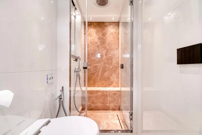  Yacht Photos Pics Luxurious bathroom on 2024 Sanlorenzo SX76 yacht with marble shower and modern fixtures.