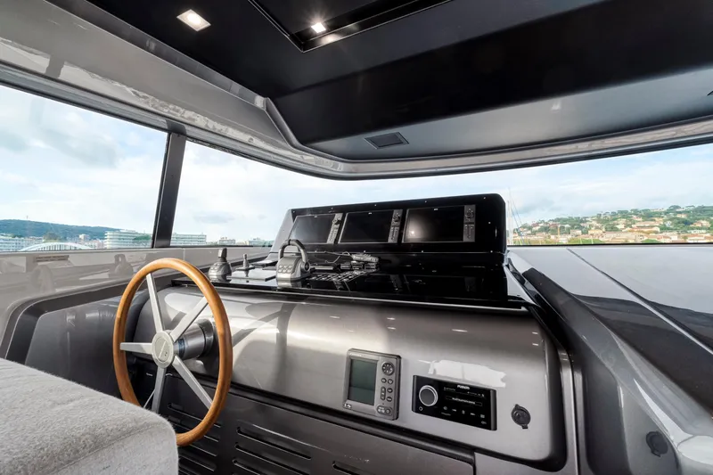  Yacht Photos Pics 2024 Sanlorenzo SX76 yacht helm with modern navigation equipment and panoramic view.