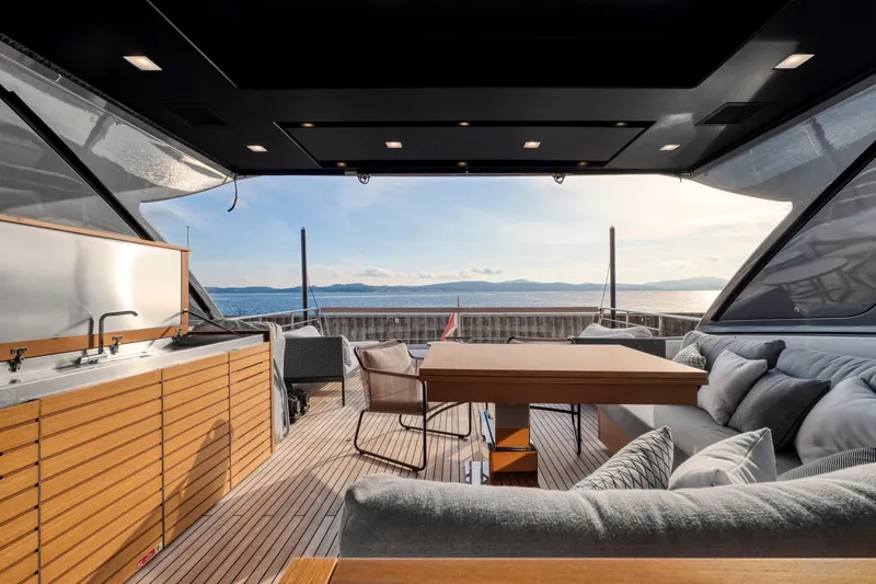  Yacht Photos Pics Luxurious 2024 Sanlorenzo SX76 yacht interior with elegant seating and ocean view.