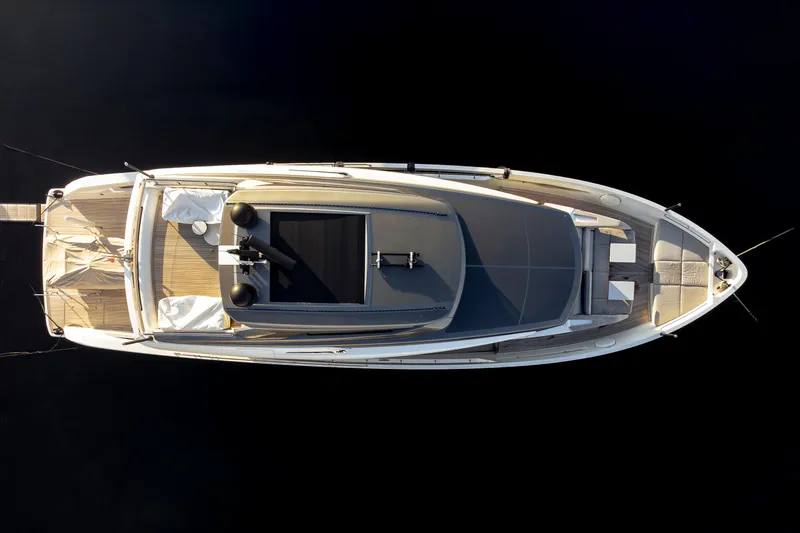  Yacht Photos Pics Overhead view of 2024 Sanlorenzo SX76 luxury yacht on dark water.