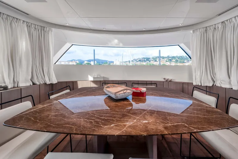  Yacht Photos Pics Luxurious dining area on 2024 Sanlorenzo SX76 yacht with elegant marble table.
