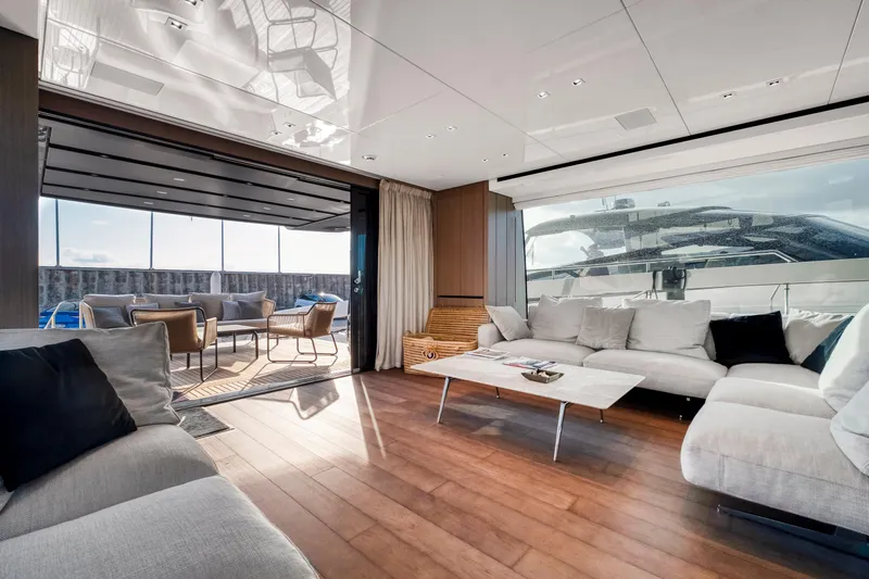  Yacht Photos Pics Luxurious interior of 2024 Sanlorenzo SX76 yacht with modern seating and open deck view.