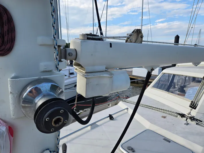 Bearaway Yacht Photos Pics Close-up of 1985 Amel Maramu sailboat rigging and winch in a marina.