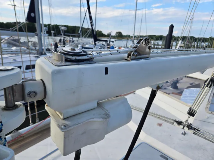 Bearaway Yacht Photos Pics Close-up of 1985 Amel Maramu sailboat mast and rigging in a marina.