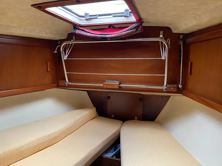 Bearaway Yacht Photos Pics 1985 Amel Maramu cabin interior with twin berths and wooden finish.